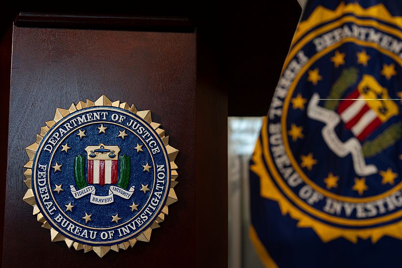 An FBI seal on a podium before a news conference at the field office in Portland, 16 January, 2025