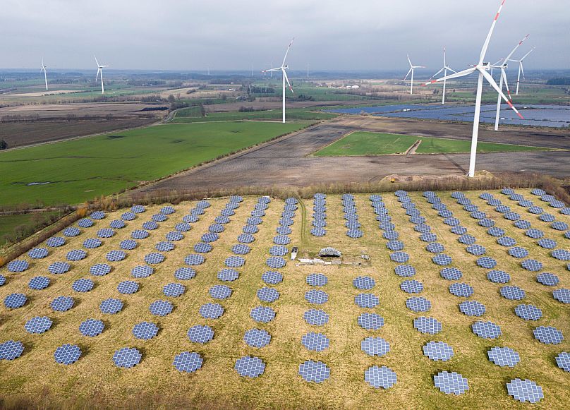 Solar panels stand on the edge of a wind farm in Sprakebüll, 14 March, 2024
