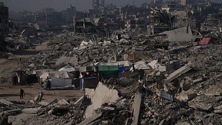 Scholar searches rubble for his books in Gaza
