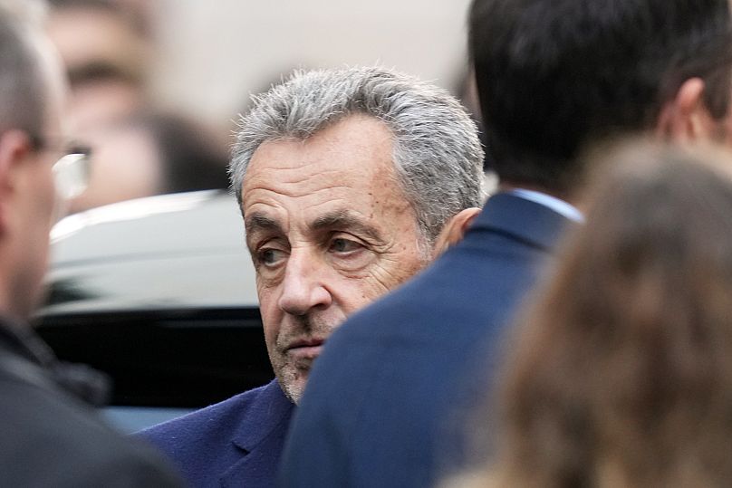 Former French President Nicolas Sarkozy reacts before entering a police car bound for prison in Paris, 21 October, 2025