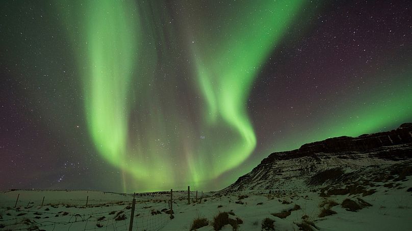 In this March 1, 2017 file photo, the Northern Lights, or aurora borealis, appear in the sky over Bifrost, Western Iceland.