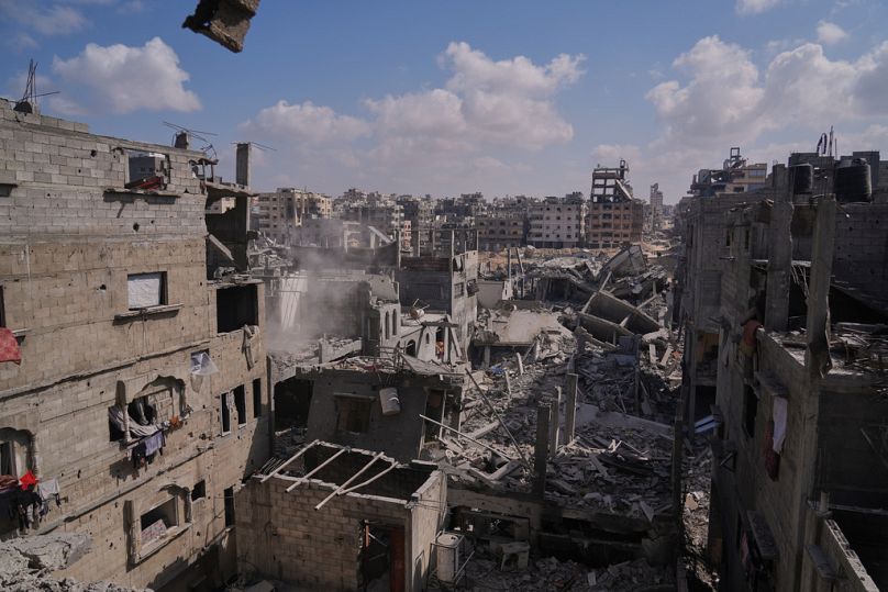 Buildings destroyed during the Israeli air and ground offensive are seen in the Al-Shati camp, in Gaza City, Friday, Oct. 24, 2025.