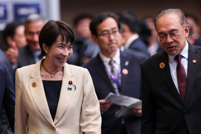 Malaysia's Prime Minister Anwar Ibrahim, right, and Japan's Prime Minister Sanae Takaichi walk during the 28th ASEAN Japan Summit, in Kuala Lumpur, Malaysia, Oct. 26, 2025