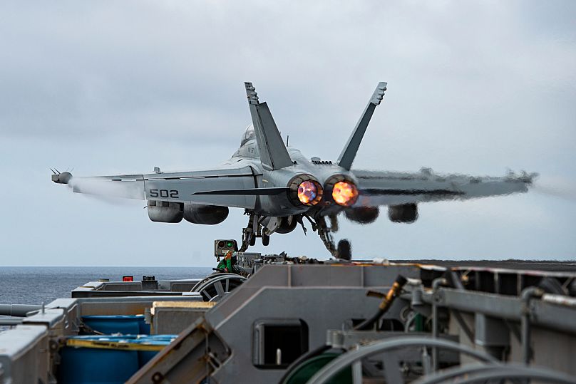 An E/A-18G Growler aircraft launches from the flight deck of the aircraft carrier USS Nimitz in the South China Sea, 12 February, 2023