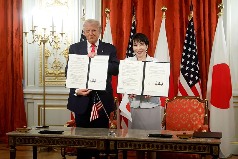 Trump, left, and Japan's Prime Minister Sanae Takaichi pose for photographs during a signing ceremony at Akasaka Palace state guest house in Tokyo, Tuesday.
