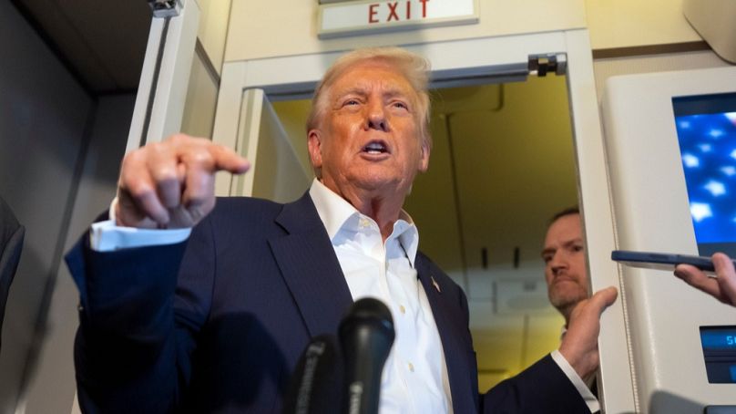 US President Donald Trump speaks to reporters aboard Air Force One while traveling from Kuala Lumpur, Malaysia, to Tokyo, Japan, Monday, Oct. 27, 2025.