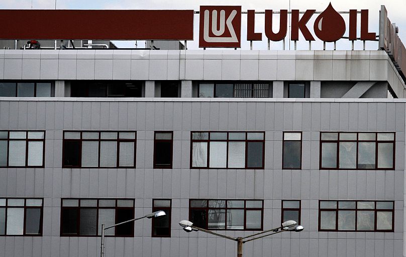 A worker on the roof of the Lukoil headquarters in the Bulgarian capital Sofia, 27 July, 2011