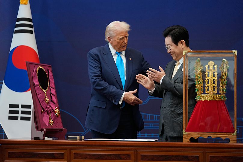 Trump shakes hands with South Korean President Lee Jae Myung as they attend a high honor ceremony at the Gyeongju National Museum in Gyoeongju, South Korea.