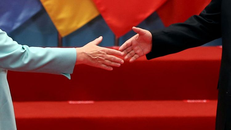 Trump trade threat looms large as Merkel heads to China