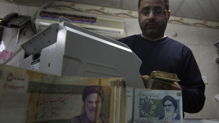 In first move since FX crackdown, Iran lowers rial vs. dollar