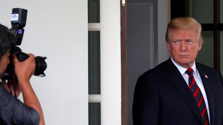 Trump says 'immune' from 'Apprentice' contestant  lawsuit, seeks delay