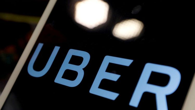 Uber trims losses and grows business, plans new stock sale