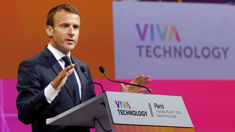 Wary of China, Macron urges Europe to set tech regulation standards
