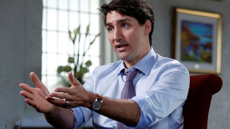 Exclusive - Canada PM raps possible U.S. auto tariffs, says linked to NAFTA