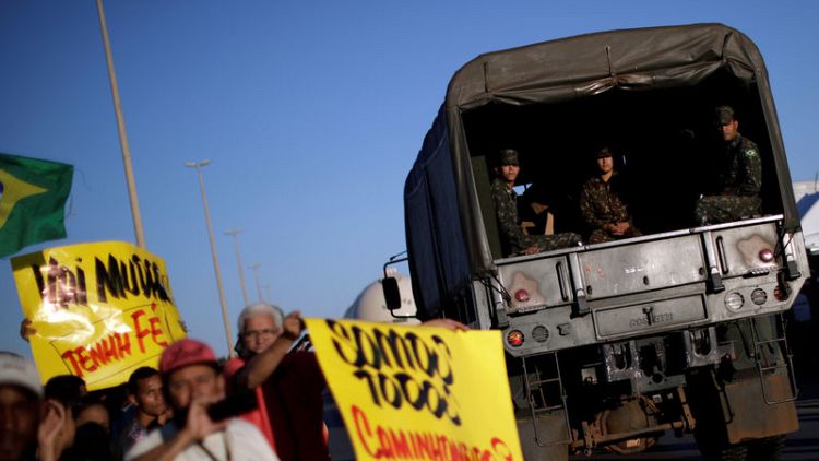 Truckers clear some roads in Brazil, but protests continue