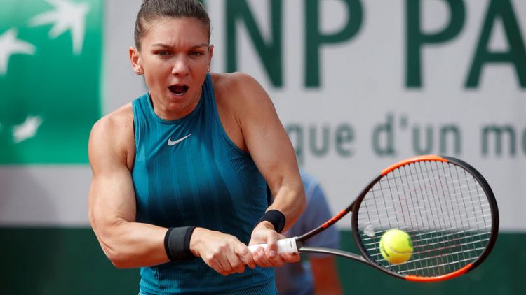 Halep subdues Petkovic after tight early tussle
