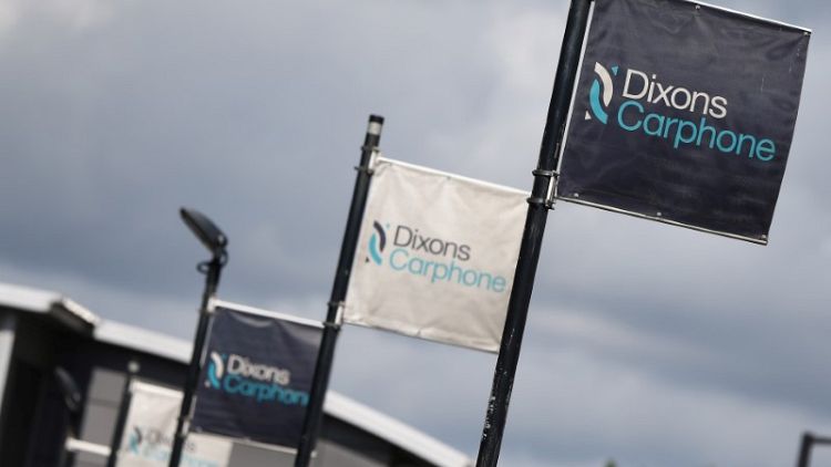 Dixons Carphone warns on profit, to close stores