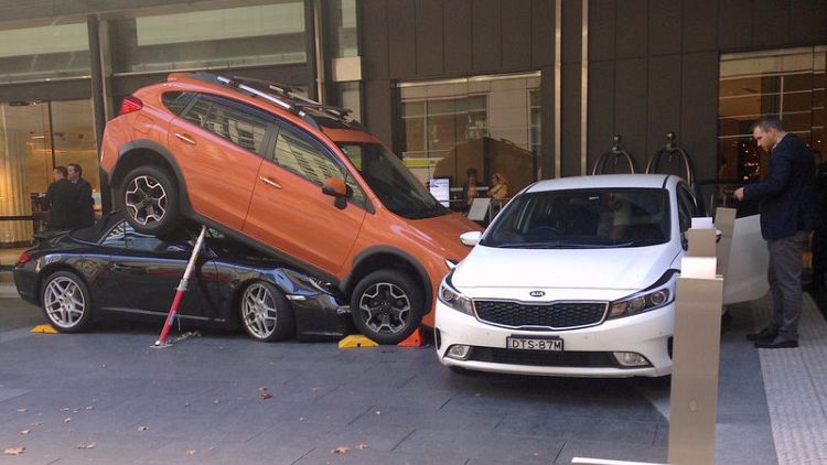Caught in a pile-up: Sydney valet parks Porsche under SUV