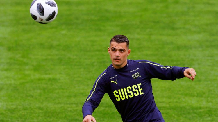 Swiss Xhaka relieved after escaping with bruised knee