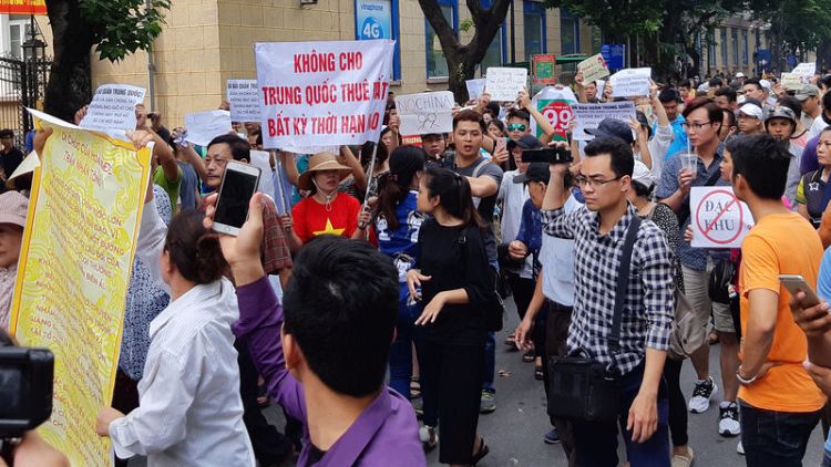 Thousands hold peaceful protests in Vietnam against foreign investment plans