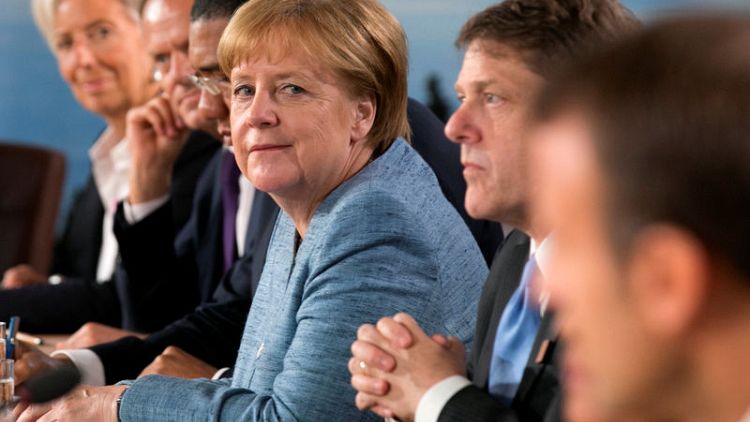 Merkel - EU will act against U.S. tariffs on steel, aluminium