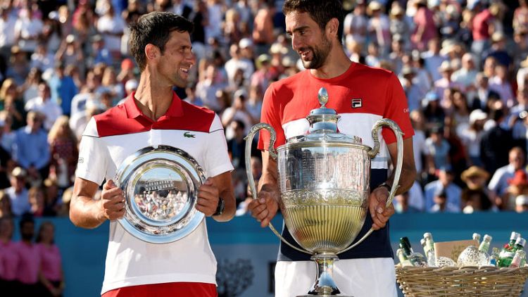 Cilic battles past Djokovic to claim Queen's title