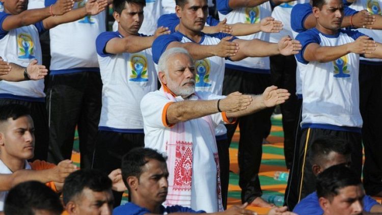 Thousands join India's Modi for world yoga celebration; some wear masks