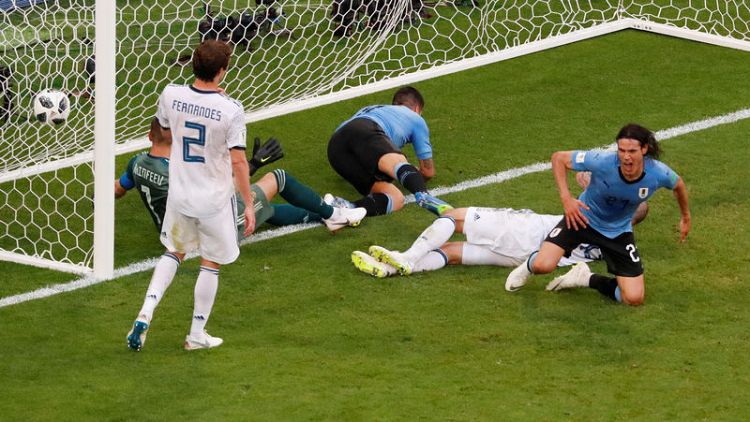 Uruguay punish sluggish Russia to top Group A