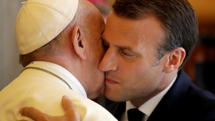 France's Macron and Pope Francis hold unusually long meeting