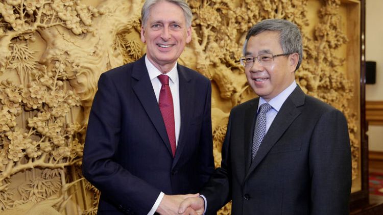 Britain committed to free trade, Hammond tells China