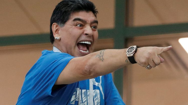 Maradona apologises over 'robbery' comments