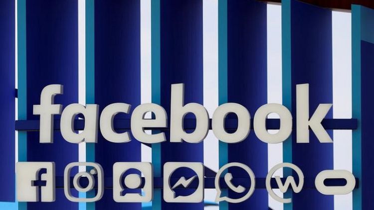 Facebook shares slip on report of widened probe on data scandal