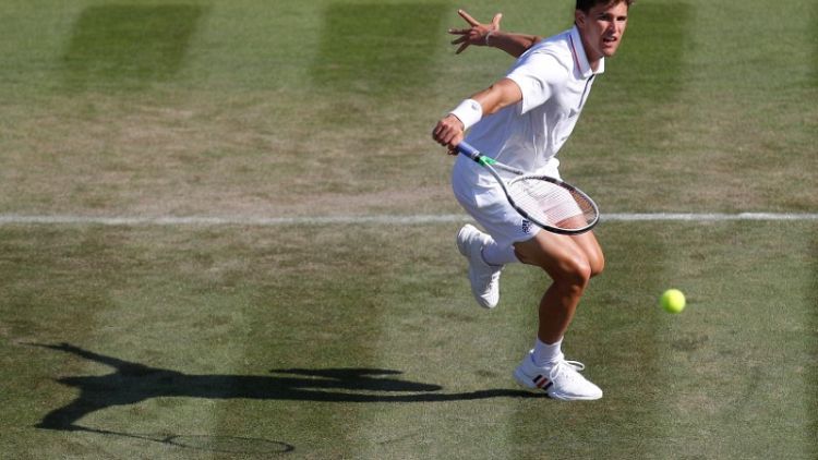 Thiem's Wimbledon bid ends with first-round retirement
