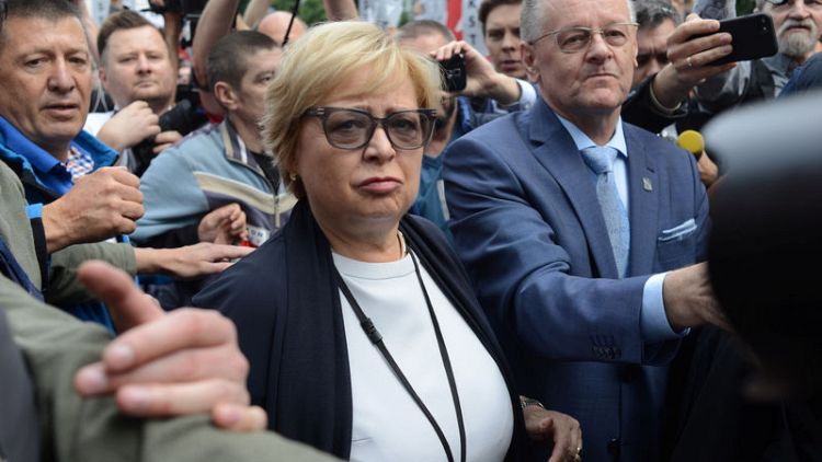 Polish judge defies retirement law, protests mount