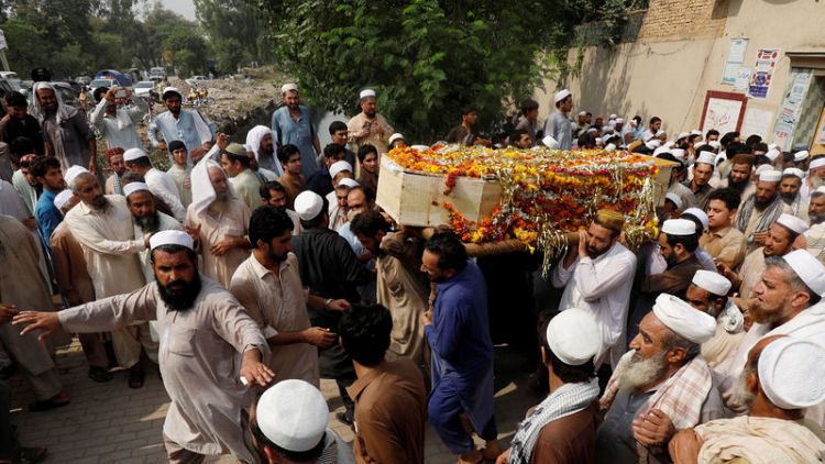 Son of slain anti-Taliban politician among 20 dead in Pakistan blast
