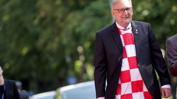 Croatia cabinet meets in soccer team jerseys to mark World Cup semi-final win