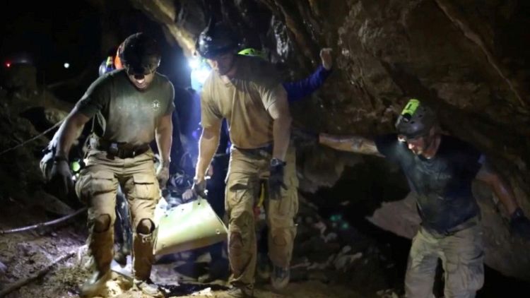 Grit, daring and  beating terror - how Thailand's cave boys were rescued