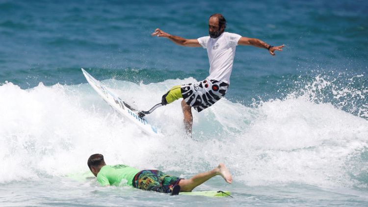 Israel holds its first competition for physically-challenged surfers