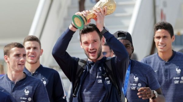 Les Bleus champions du monde font un retour triomphal en France Les Bleus champions du monde font un retour triomphal en France