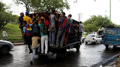 Weary Venezuelans rely on 'dog cart' transports as buses succumb to crisis