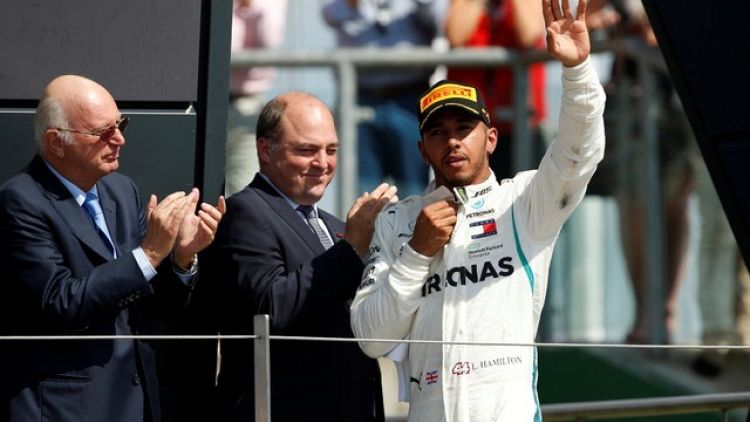 F1 champion Hamilton staying with Mercedes until 2020