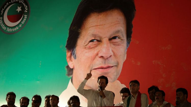 Pakistan's Imran Khan seeks election win over jailed ex-PM's party