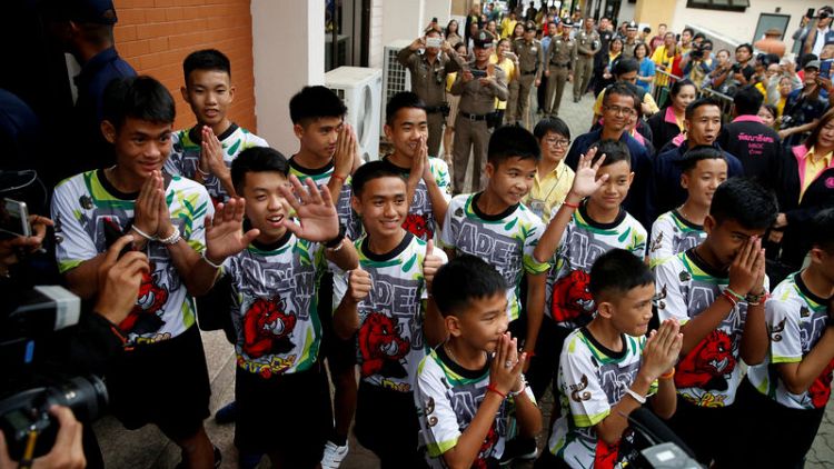 Candles and chanting: Thai cave boys begin ceremony to become Buddhist novices