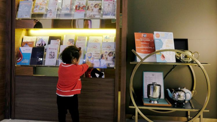 Hong Kong clinics prepare for influx of mainland visitors after China vaccine scandal