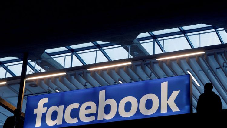 Facebook disappoints on revenue, active users; shares fall nine percent