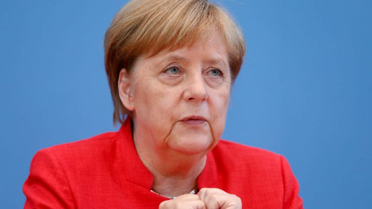 Opposition parties blast Merkel over meeting with Russian officials