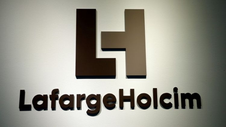 LafargeHolcim first-half profit drops 43 percent as restructuring charges bite
