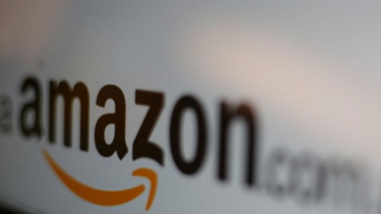 Amazon shares hit record high as profit tops $2 billion for first time