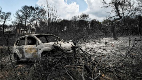 Restes d'une voiture calcinée à Mati en Grèce, le 27 juillet 2018 Restes d'une voiture calcinée à Mati en Grèce, le 27 juillet 2018