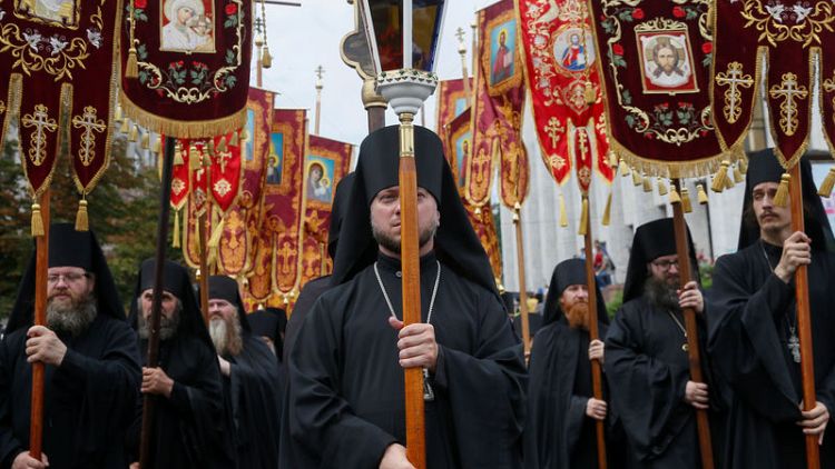 Ukraine marks church anniversary, aims to tackle Kremlin influence